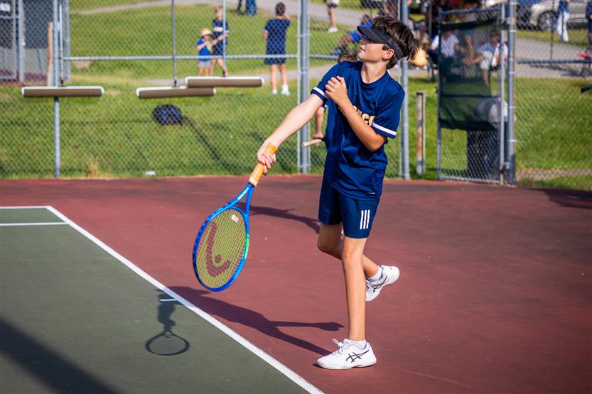 Students play tennis